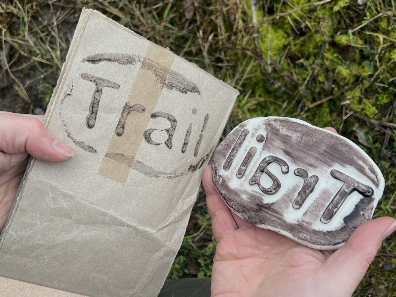 Recycled paper and printing the word 'trail'